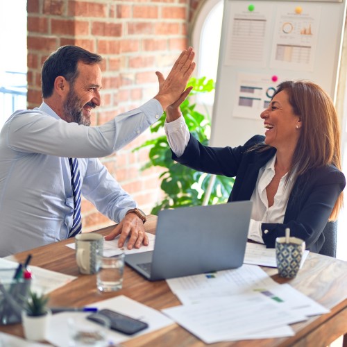 a man and women giving a high five